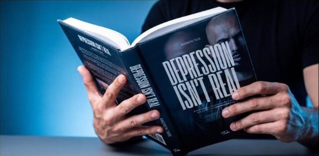 Reader holding Depression Isn't Real open