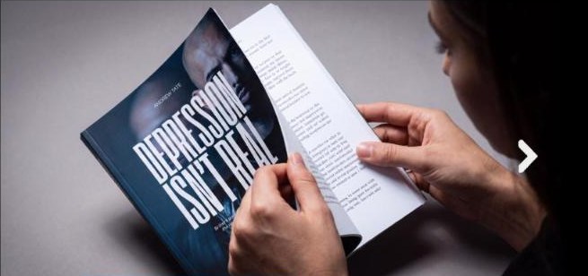Reader flicking through Depression Isn't Real